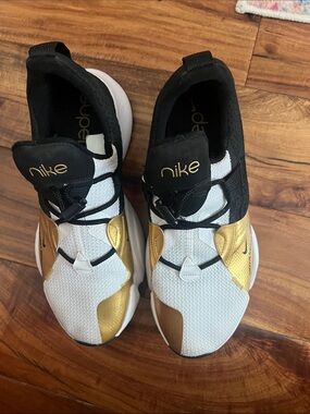 Nike White Black and Gold Slip-On Athletic Sneakers